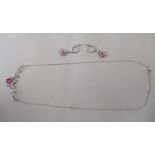 A pair of pink gem set silver coloured metal earrings; and a matching necklet, on a dog clip clasp