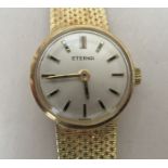 A ladies 14ct gold cased Eterna wristwatch, on a 14ct gold strap