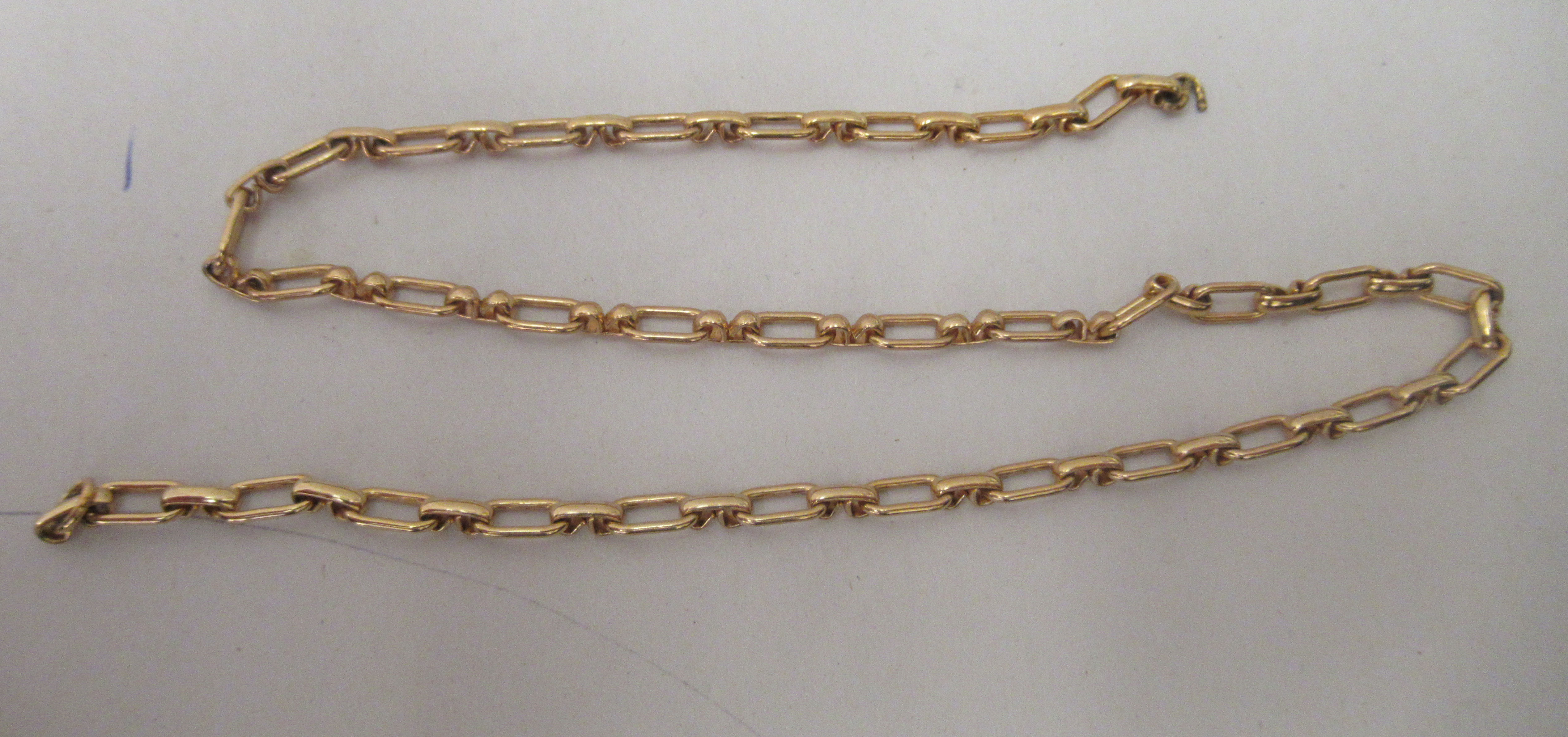 A yellow metal hoop link neckchain
