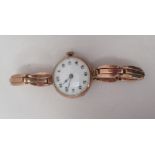 A 9ct gold cased ladies wristwatch, faced by an Arabic dial