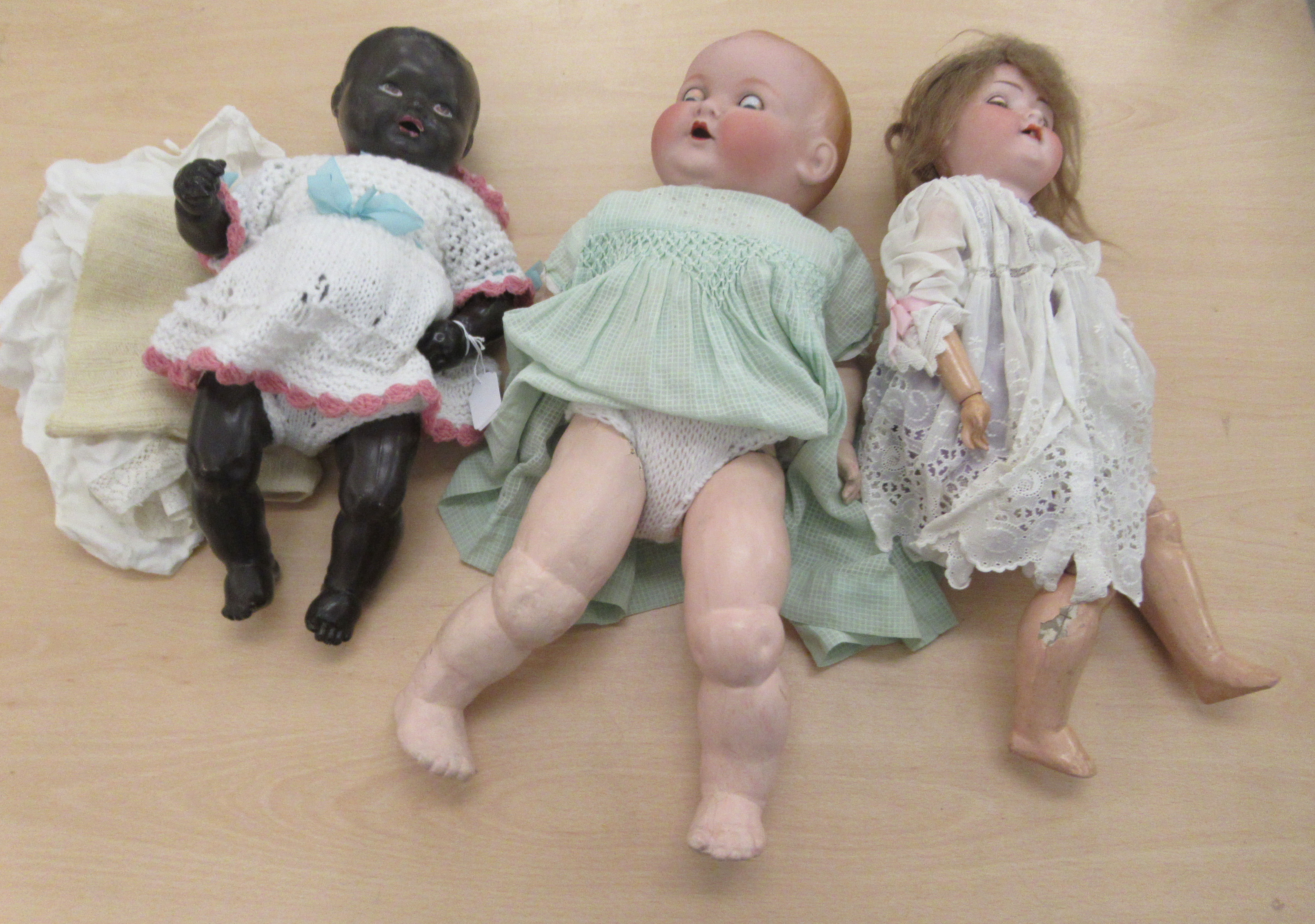 Three dolls: to include an Armand Maiselle bisque head example with weighted sleepy eyes  18"h