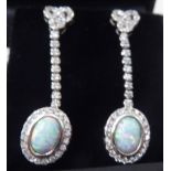 A pair of silver opal and cubic zirconia set pendant earrings