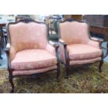 A pair of modern Louis XV design, lacquered and stained beech salon chairs with gold and pink fabric