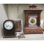 An early 20thC German walnut cased mantle clock; the Junghans gong strike movement faced by an