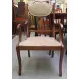 An Edwardian satinwood inlaid mahogany salon chair with a fabric upholstered back pad and seat,