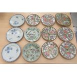 A set of three late 18thC Chinese porcelain plates, lightly decorated with flora  9"dia; and later