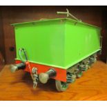 A 3.25" (approx.) gauge six wheel model railway tender, in black and green livery  16"L