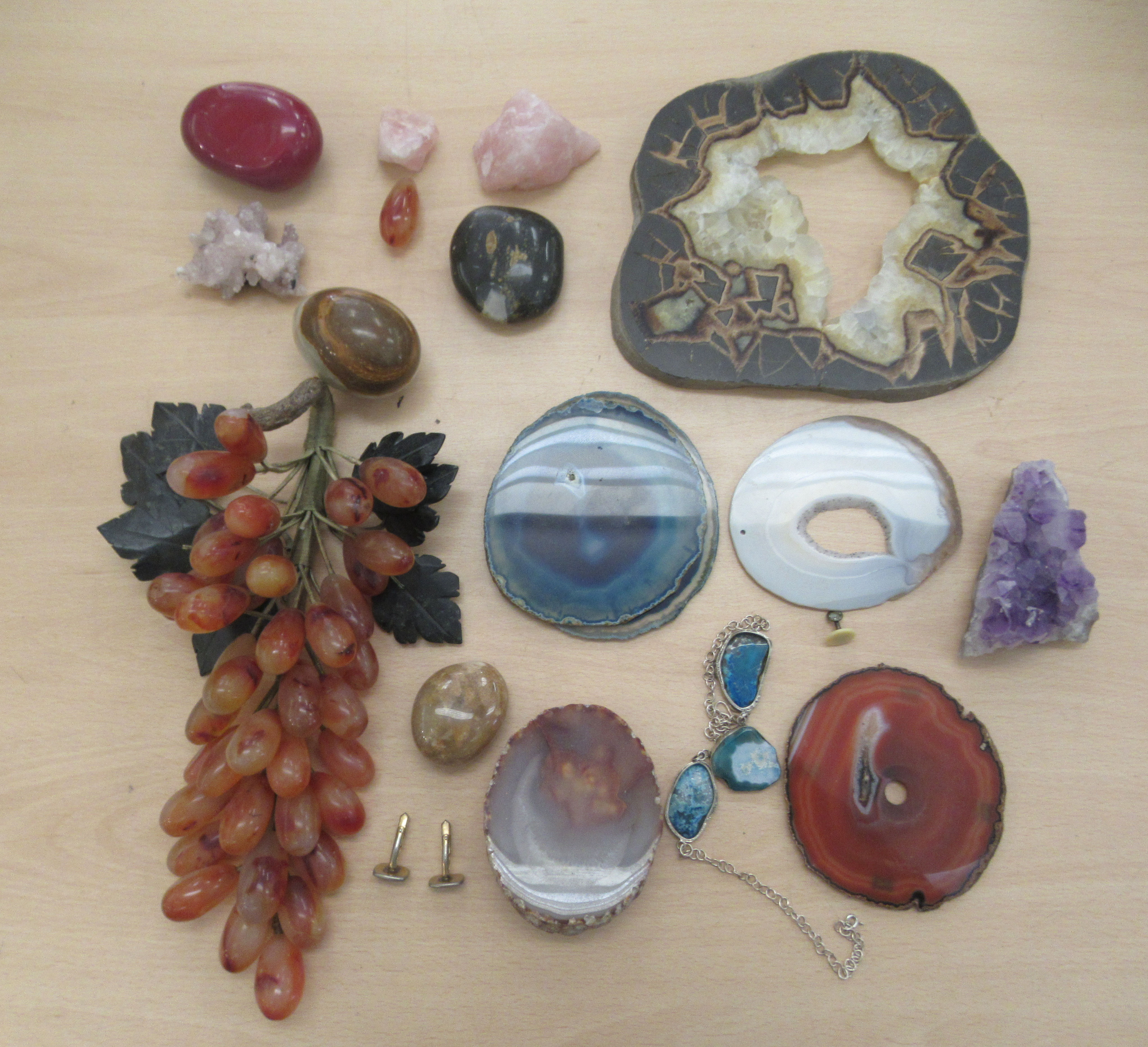 A selection of rough-cut and worked, coloured hardstone: to include a bunch of grapes