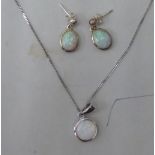 A pair of opal set, silver earrings and an attendant pendant, on a fine neckchain and ring-bolt