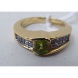 A 14ct gold diamond and peridot set ring