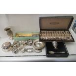 Silver and white metal collectables: to include napkin rings, decanter labels and a ring box