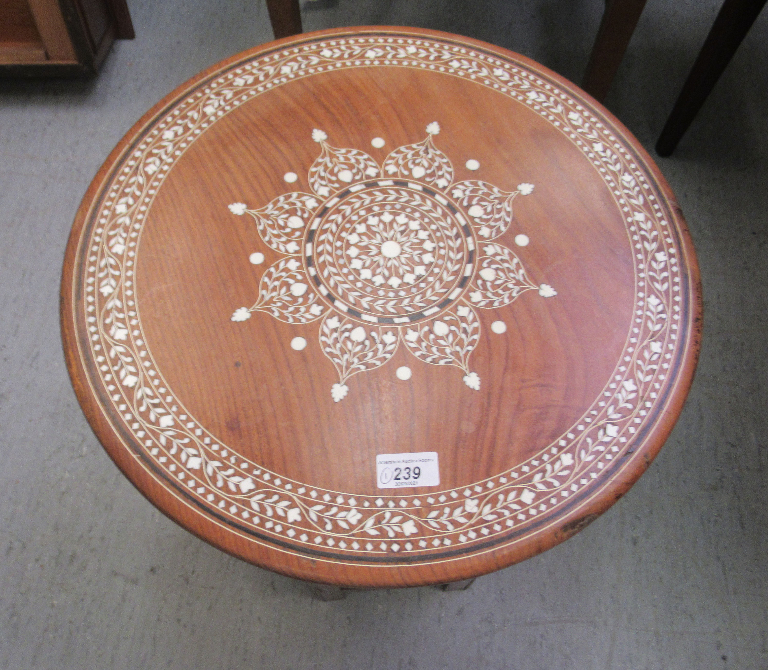 A 20thC Indian bone inlaid fruitwood occasional table, decorated with floral designs  18"h  18"dia - Image 2 of 4