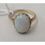 An 18ct gold ring, set with a cabochon cut opal