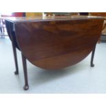 A George III and later mahogany drop leaf table, raised on turned, tapered legs and pad feet  28"