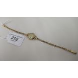 A ladies 9ct gold Camerer Cuss bracelet watch, faced by a baton dial