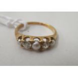 An 18ct gold ring, set with alternating diamonds and seed pearls