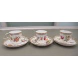 A set of three Dresden porcelain cups and saucers, decorated with flora and gilding