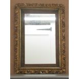 A late 19thC mirror, the plate, set in a fabric covered and carved foliate gilt frame  15" x 19"