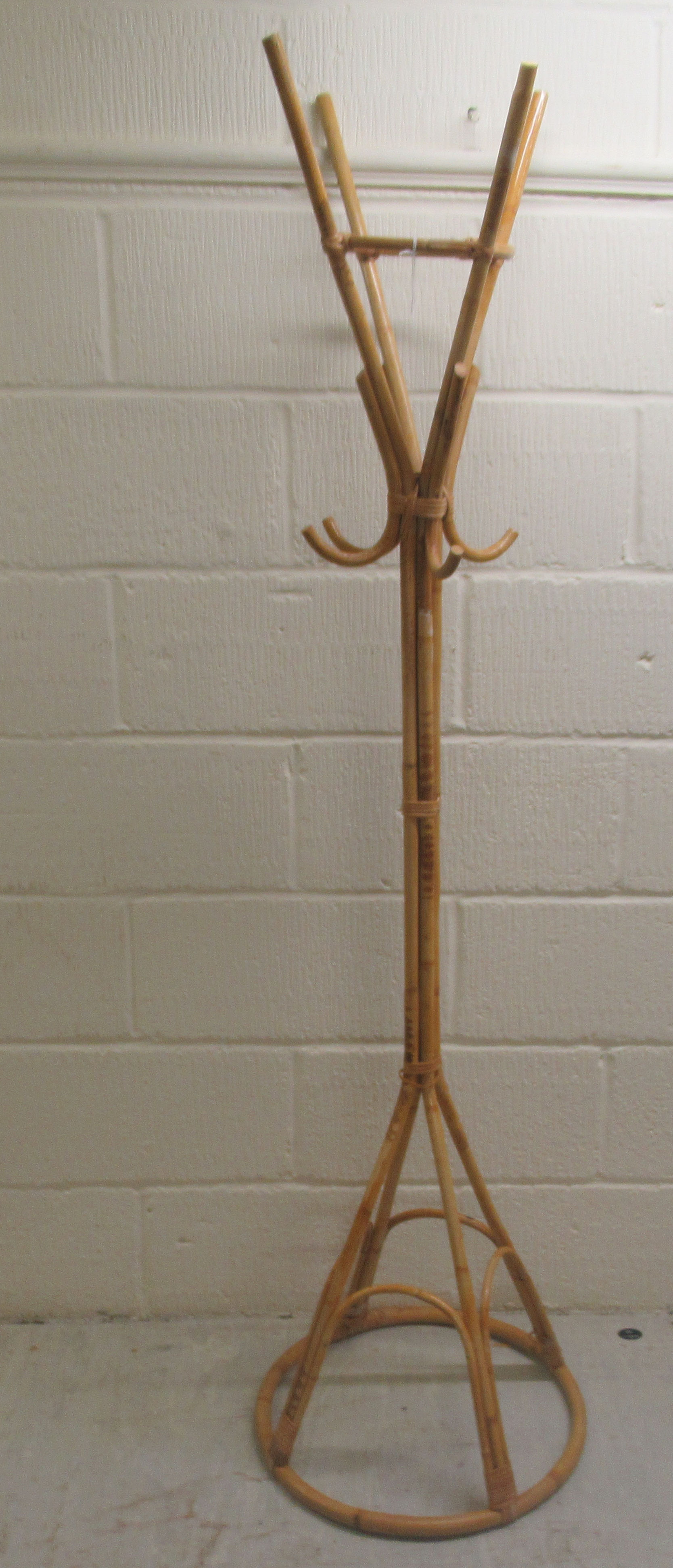 A modern bamboo effect stickstand  62"h