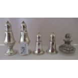 A pair of Sterling silver pedestal pepper pots and another pair of conical form; and a clear glass