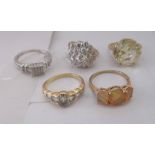 Five white and yellow metal rings, each set with cubic zircon and coloured stones