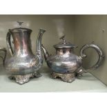 A late Victorian engraved silver plated teapot and matching hot water pot