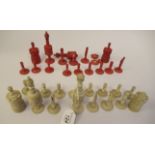 A late 19th/early 20thC carved and turned beetlenut stained and naturally coloured bone chess set