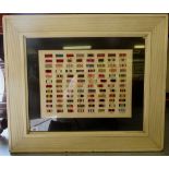 A display of  eighty-four military and associated medal ribbons  18" x 13"  framed  (Please Note: