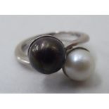 An 18ct white gold ring set with two pearls