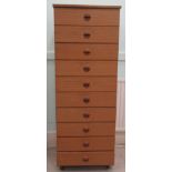 A Schreiber teak ten drawer tallboy, on a plinth  53"h  19.5"w