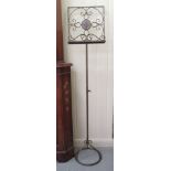 A 20thC freestanding, painted wrought metal, height adjustable music stand  54"h