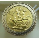 A Queen Elizabeth II sovereign, St George on the obverse 1966, set in a 9ct gold ring