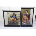 Two modern Japanese figures, wearing traditional fabric robes  12"h in partially glazed display