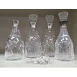 A set of four cut crystal carafes with applied silver pouring collars  Birmingham 1915   6.25"h