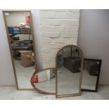 Four dissimilar modern framed mirrors  various forms  largest 47" x 13"