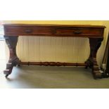 An early Victorian mahogany, two drawer serving table, raised on opposing vase shaped, pierced