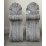 A pair of scroll carved grey marble corbels  16"h