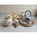 Five items of Royal Worcester porcelain, viz. a square teapot with blue and white decorative; a leaf