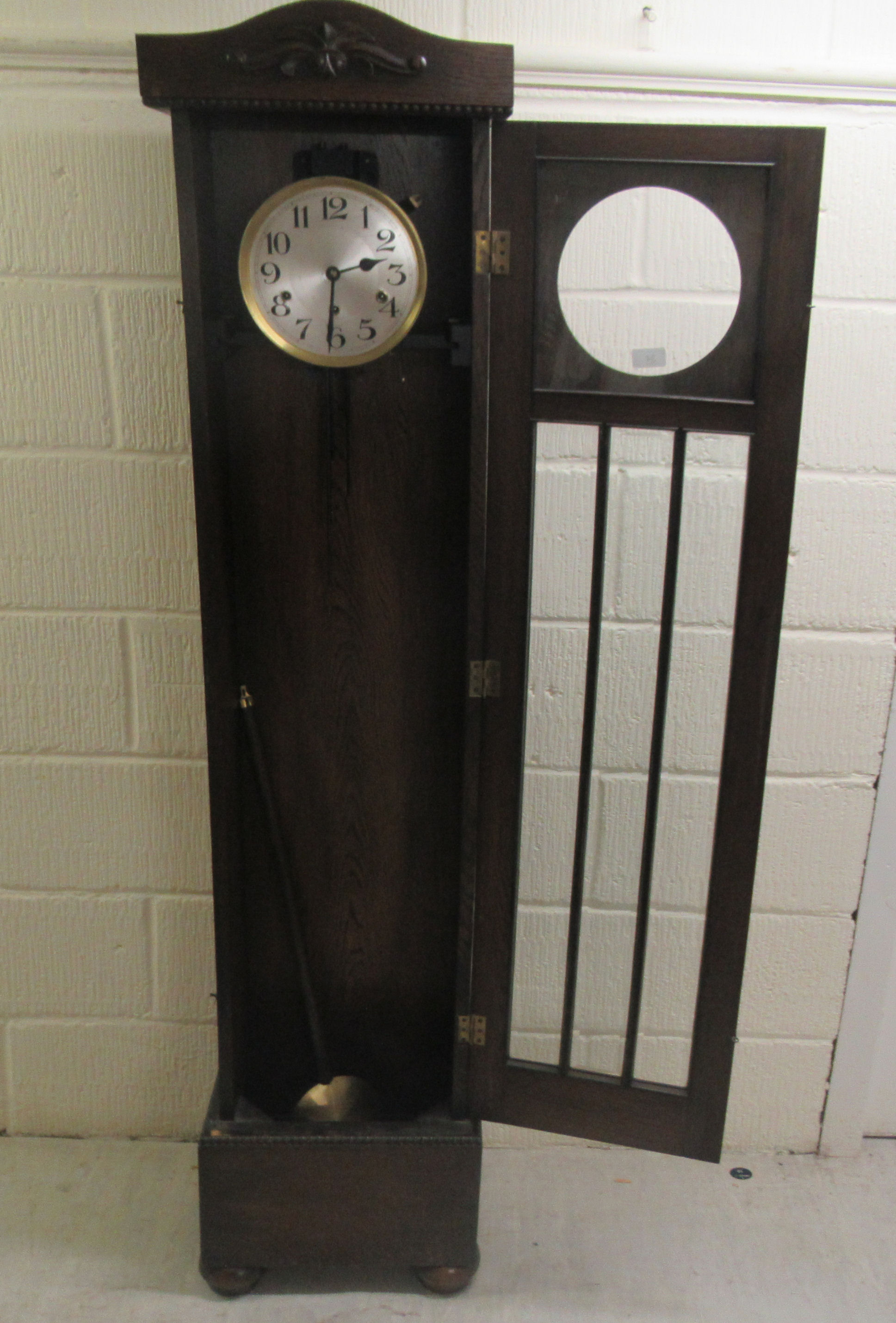 An early/mid 20thC oak cased granddaughter clock, the chiming movement faced by a brushed steel - Image 4 of 6