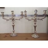 A pair of mid 20thC Rococo design silver plated twin branch candelabra  22"h  19"w
