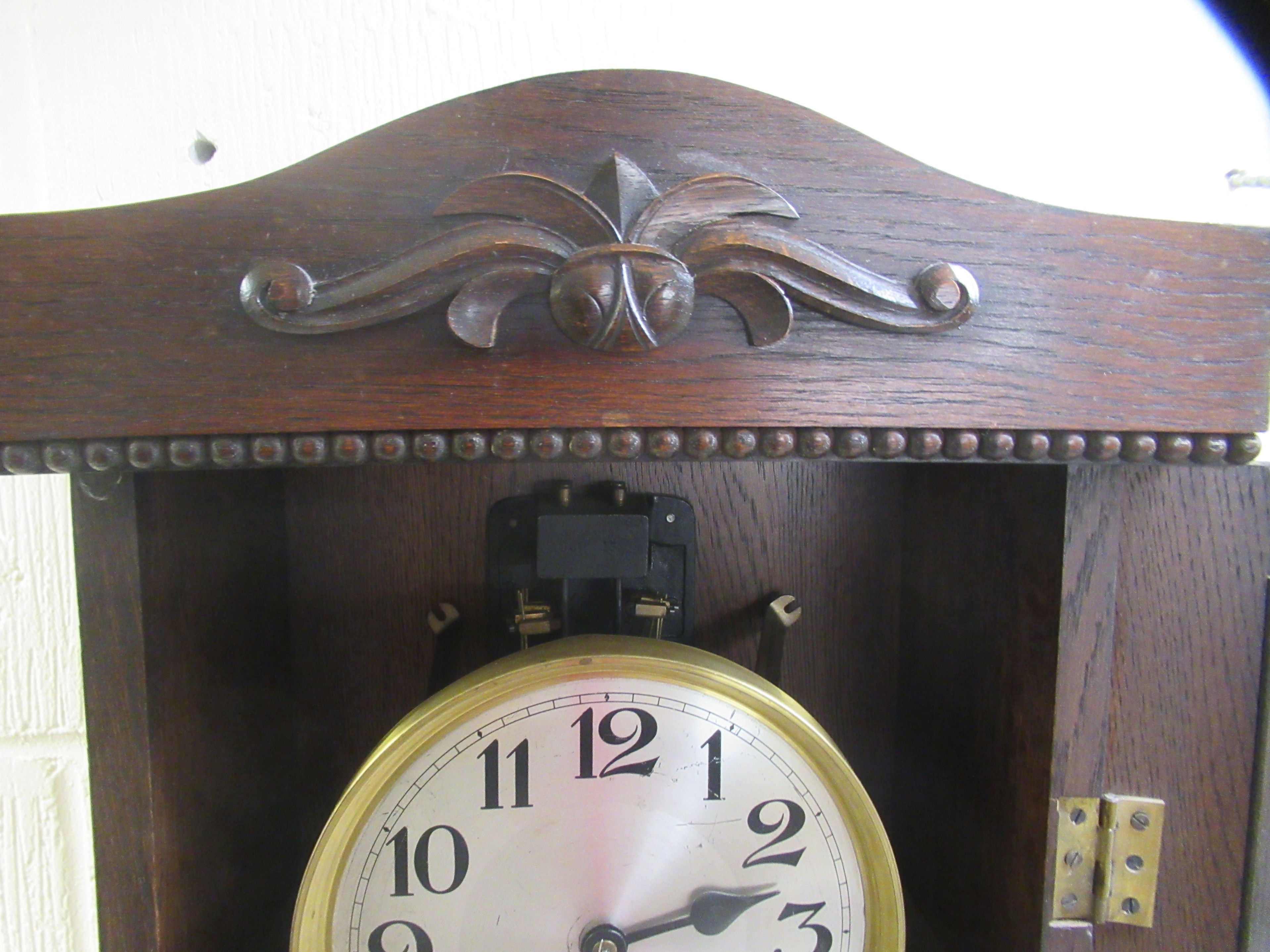 An early/mid 20thC oak cased granddaughter clock, the chiming movement faced by a brushed steel - Image 5 of 6