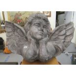 A grey painted papier mache model, the head and shoulders of an angel  22"h