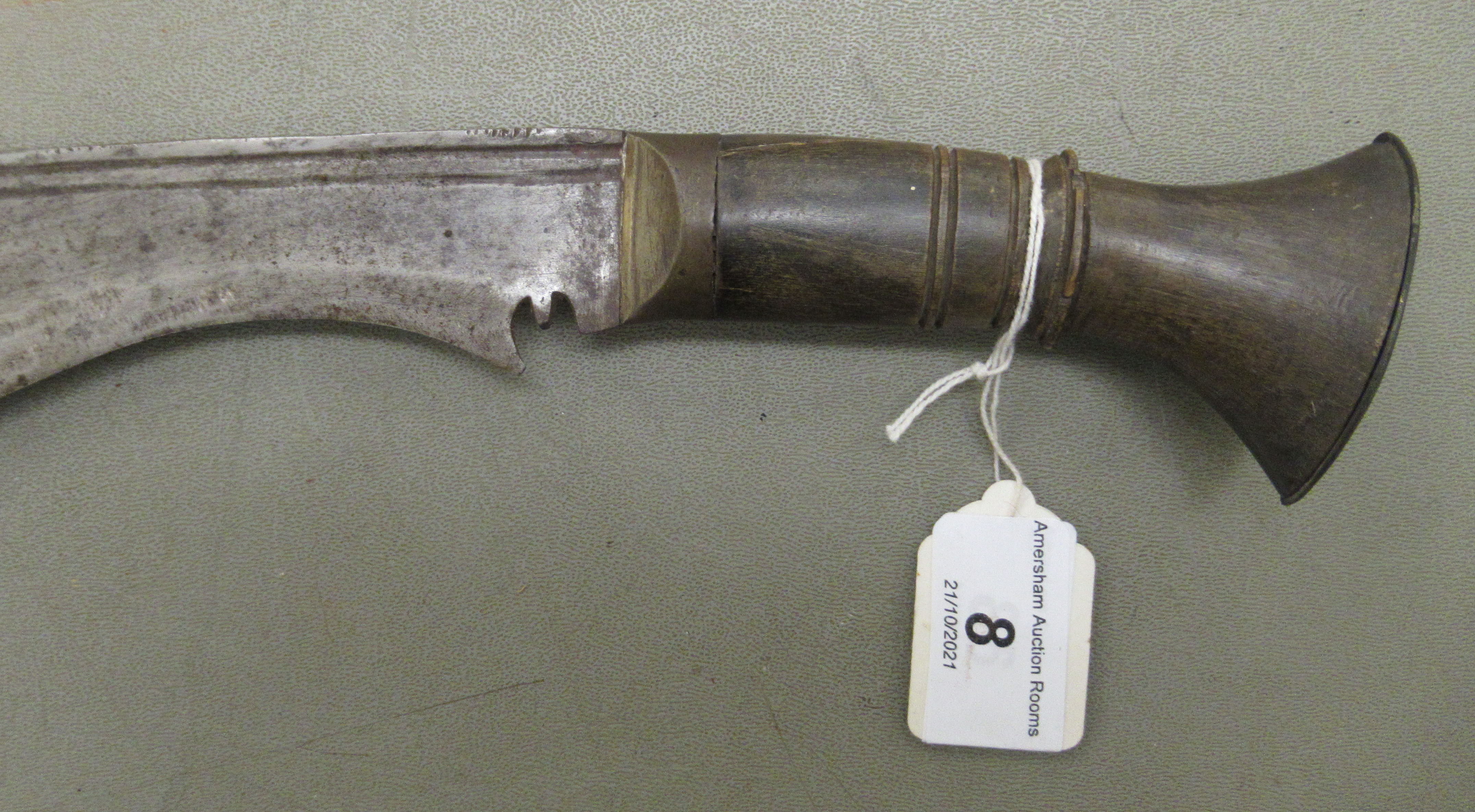 A 20thC Nepalese kukri on a, probably, horn handle  the blade 13"L, in a stitched hide sheath - Image 2 of 7