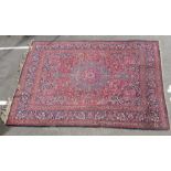 A Meshed carpet profusely decorated with floral designs, on a multi-coloured ground  120" x 162"