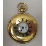 An 18ct gold cased half hunter pocket watch faced by a Roman dial with subsidiary seconds  inscribed