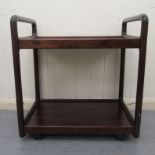 A mid 20thC Danish Skovby rosewood finished two tier tea trolley, on castors  26"h  25"w