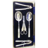 A late 19thC silver plated fruit set  comprising a pair of serving spoons, on mother-of-pearl