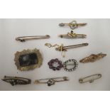 Gold coloured metal and other brooches and pins