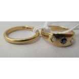 An 18ct gold wedding band; and a yellow metal gypsy style ring, set with diamonds and a sapphire