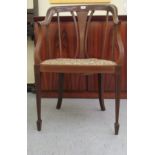 An Edwardian mahogany and marquetry horseshoe shaped back chair with a waisted splat and downswept